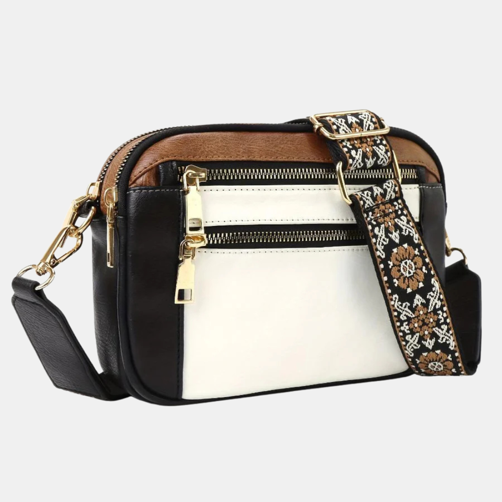 NANCY | FÖRÄNDRINGEN LILLA CROSSBODY VÄSKA
