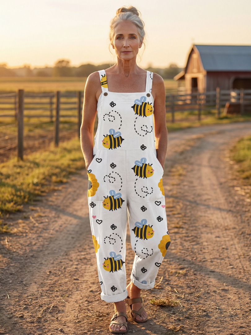 Lena | Jumpsuit med vida ben i vitt med bi- och blomtryck